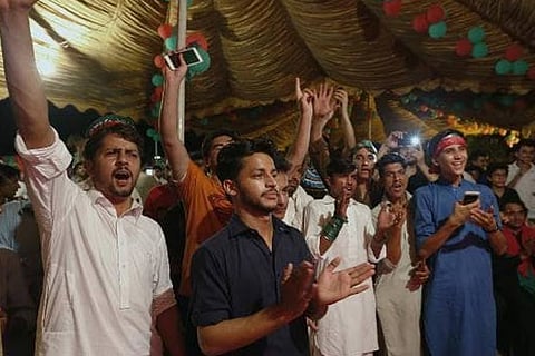 Supporters of Imran Khan celebrate projected unofficial results