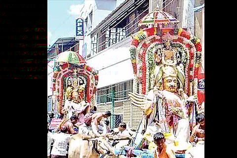 Deities being taken in a procession on Monday