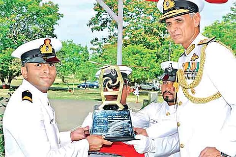 Kerala Governor Trophy being awarded to best outstanding cadet Vishnu Menon by Vice Admiral Karambir