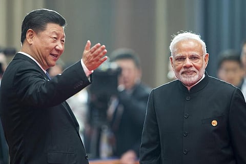 Chinese President Xi Jinping welcomes Narendra Modi for a meeting at the SCO summit