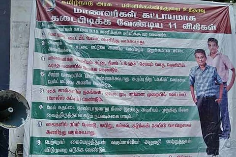 A flex board displaying the new rules put up in front of the government school at Thorapadi, Vellore