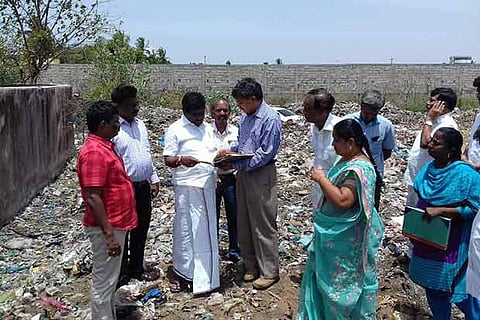 MLA P Balaraman is briefed by government officials about the underground drainage project in Ponneri