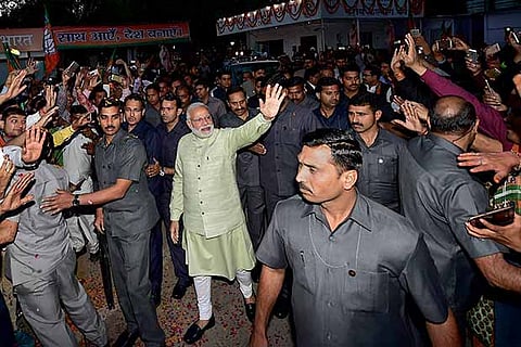 Prime Minister Narendra Modi, surrounded by security personnel