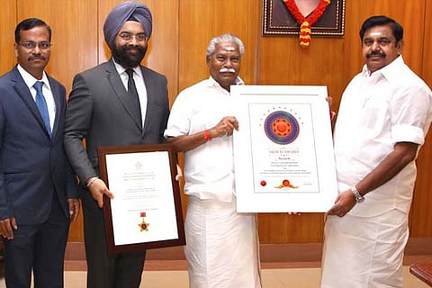 Agriculture minister R Duraikannu shows the award received for the Uzhavan app to CM EPS