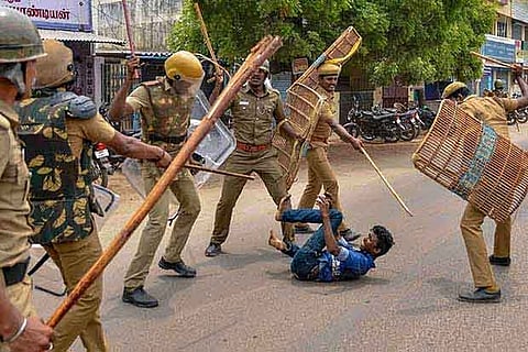 A file picture of the police personnel caning a youth during the anti-Sterlite protest, Thoothukudi