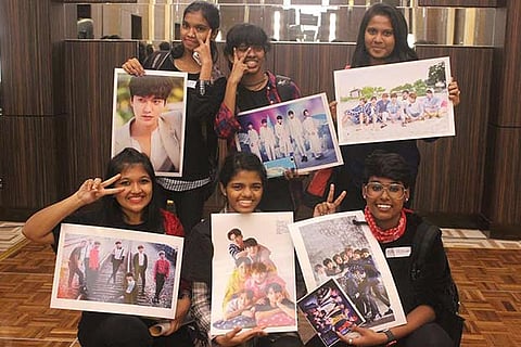 Members of The K-Wave India holding posters of their favourite Korean stars