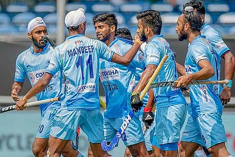 Indian players celebrate the first goal against Belgium