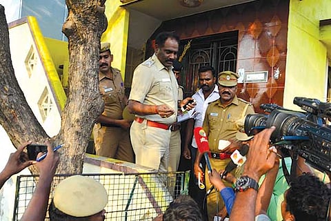 Police present outside the house in which the encounter took place