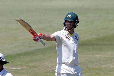 Australia's Mitchell Marsh celebrates scoring a half century