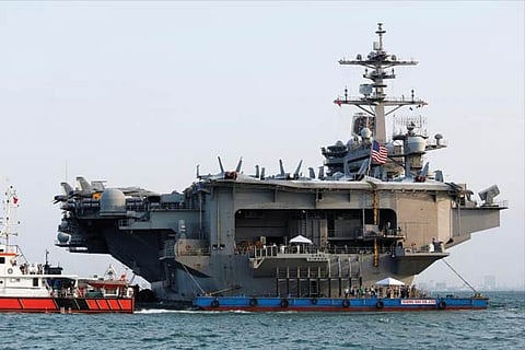US Navy aircraft carrier, USS Carl Vinson, docks at a port in Danang, Vietnam