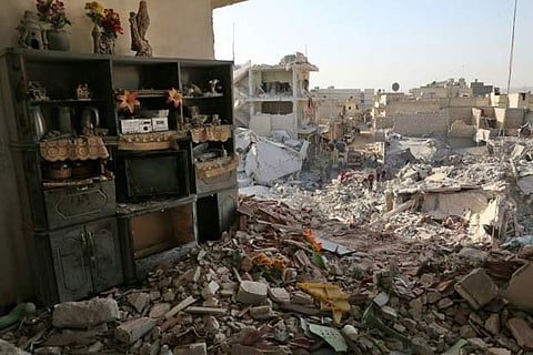 The rubble left by air strikes in rebel-held Atareb in northern Syria in November last year