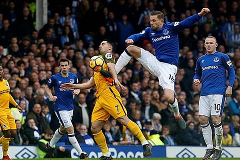 Everton's Gylfi Sigurdsson in action with Brighton's Beram Kayal