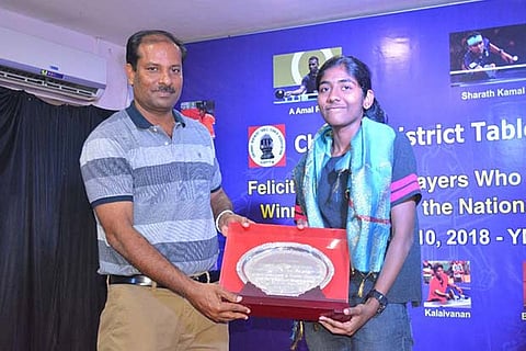 Selena Selvakumar (right) receives the silver plate from Md Riaz