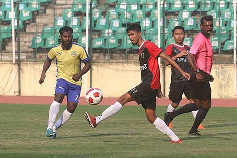 Saddam Hossain (right) of Chennai FC battles for the ball with a RBI defender