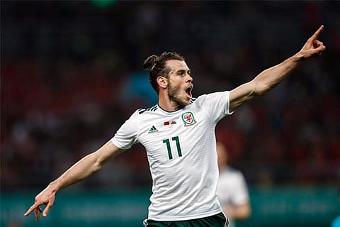 Gareth Bale of Wales celebrates after scoring a goal