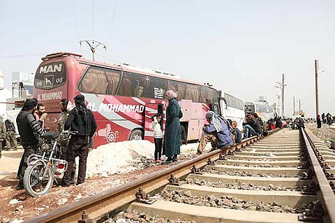 Syrians evacuated from the rebel-held town of Harasta in Eastern Ghouta