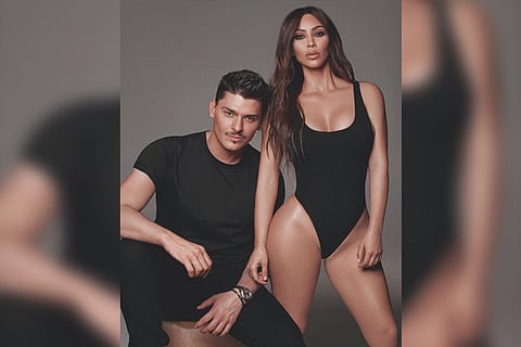 Kim Kardashian alongside her friend and make-up artist Mario Dedivanovic