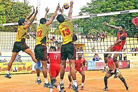 SRM University players attempt to block a shot during their game against Panimalar