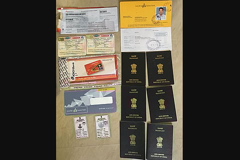 Fake passports and other documents seized from the duo