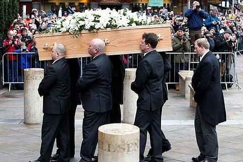 Pallbearers carry the coffin of theoretical physicist Prof Stephen Hawking