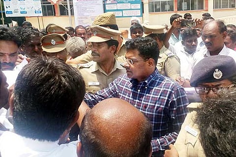 Tiruvannamalai Collector KS Kandasamy receives the petition from the protesting residents on Tuesday