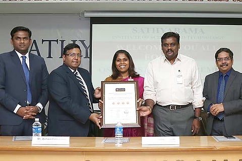 Dr Marie Johnson and Dr Mariazeena Johnson receive award from Ashwin Fernandes