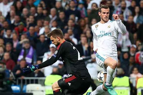 Real Madrid's Gareth Bale in action with Bayern Munich's Sven Ulreich