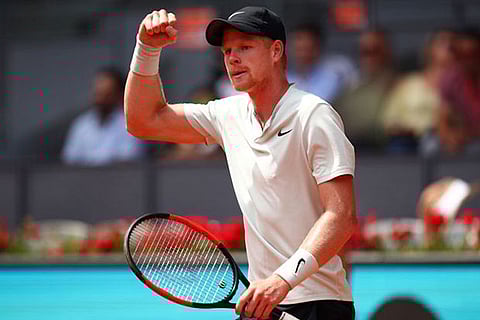 Kyle Edmund celebrates his win over former world number one Novak Djokovic