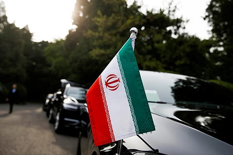 Cars of Iranian delegation are parked outside a building at Diaoyutai state guesthouse in Beijing