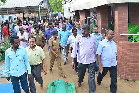 Officials and Waqf Board members coming out of the dargah