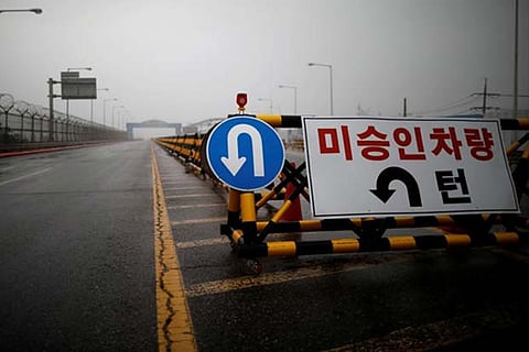 A traffic sign is seen on the Grand Unification Bridge which leads to the truce village Panmunjom