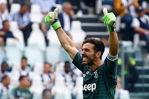 Juventus' Gianluigi Buffon gestures to the fans
