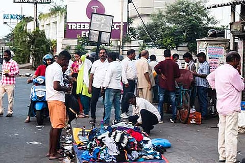 A vendor sells garments on Gandhi Irwin Road (opposite Egmore Railway Station)