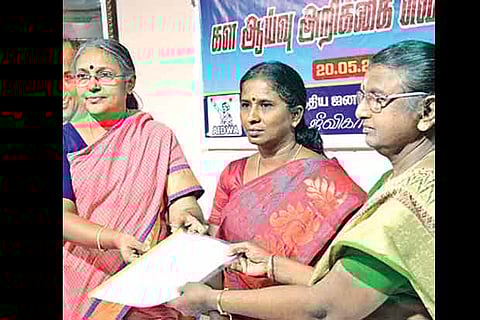 U Vasuki (left), AIDWA, releases a report on workplace safety for women, in Madurai on Sunday