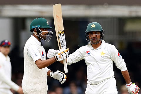 (L) Babar Azam celebrates his fifty