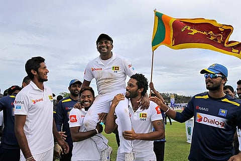 Team members carry Sri Lankan bowler Rangana Herath who played his career last test cricket match