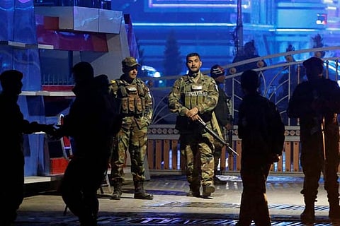 Afghan security forces arrive at the site of a suicide bomb attack in Kabul, Afghanistan