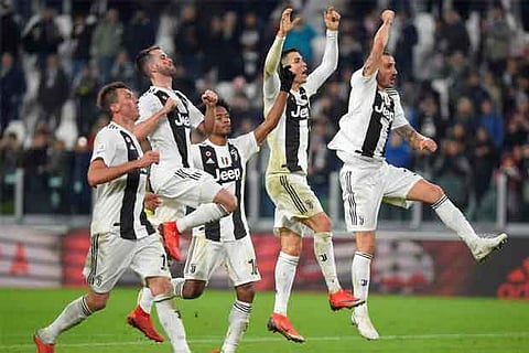 Juventus' Cristiano Ronaldo and teammates celebrate after the match