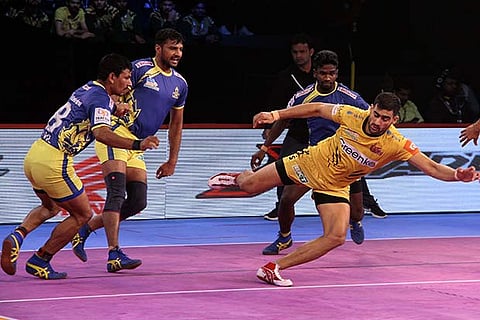 Telugu Titans raider Rahul Chaudhari in action against Tamil Thalaivas in the Pro Kabaddi League