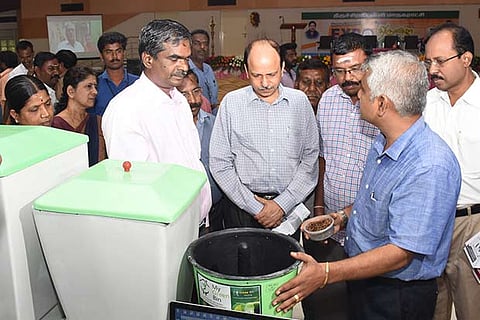 Postmaster General Ambesh Upmanyu (centre) is briefed about a product at the exhibition in Tiruchy