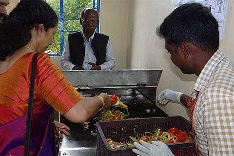 NIT Tiruchy Director Mini Shaji Thomas disposes organic waste into newly-inaugurated biogas plant