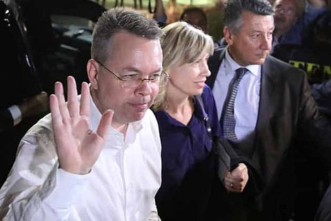 US pastor Andrew Brunson and his wife Norrine arrive at the airport in Izmir, Turkey