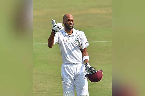 West Indies cricketer Rostam Chase celebrates his century