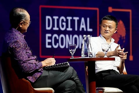 World Bank President Jim Yong Kim (L) with Alibaba Group co-founder and Executive Chairman Jack Ma
