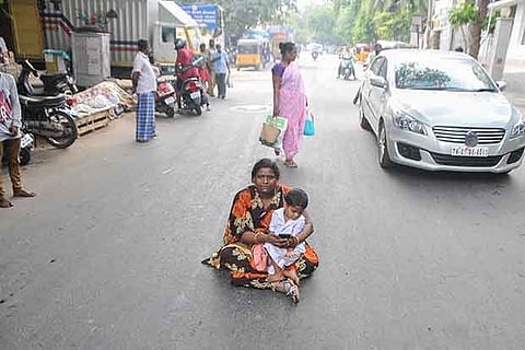 Manomani, a homemaker from Nochikuppam, staging a dharna at Mylapore on Monday