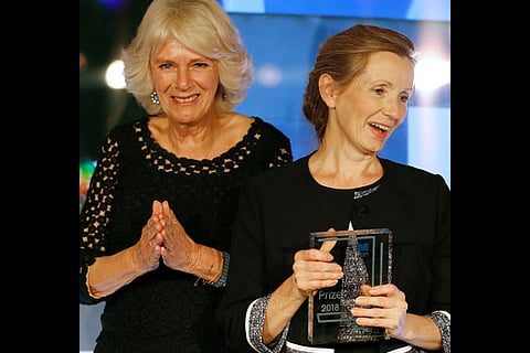 Camilla, the Duchess of Cornwall presents the Man Booker Prize 2018 to writer Anna Burns(R)