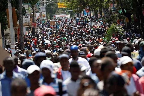 At least one dead, dozens hurt as thousands protest graft in Haiti