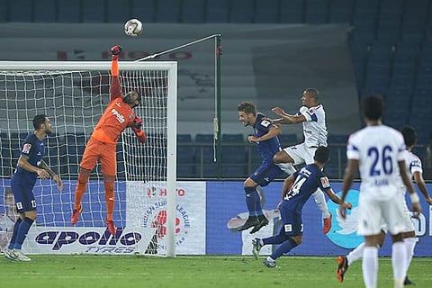 Chennaiyin FC goalkeeper Karanjit Singh makes a good save against Delhi Dynamos in the ISL match