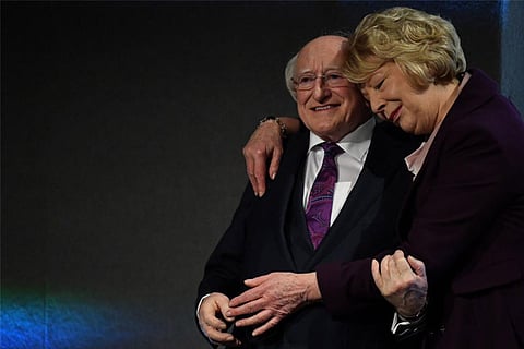 Ireland's President Michael D Higgins is declared elected and congratulated by his wife Sabina Higg