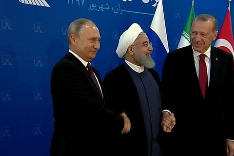 Vladimir Putin of Russia, Hassan Rouhani of Iran and Tayyip Erdogan of Turkey
